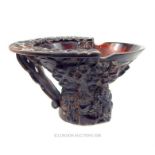 A large, carved, Chinese, buffalo horn, libation cup