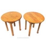 A pair of early 20th century, oak, circular-topped, occasional tables