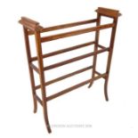 An Edwardian, oak towel rail with stringed, satin-wood inlay