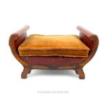 An early 20th century brown leather upholstered stool