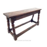 An early 20th century carved oak joint stool