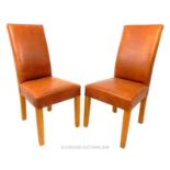 A pair of soft, brown, calf-leather, upholstered chairs, purchased from Harrods