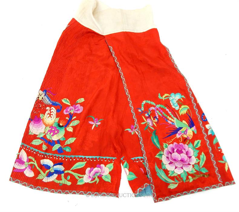 An early 20th century, Chinese, red silk and embroidered skirt