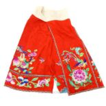 An early 20th century, Chinese, red silk and embroidered skirt