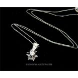 An 18 ct white gold, diamond star pendant on 18 ct white gold chain