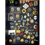 A collection of costume jewellery brooches and earrings