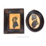 Two, 19th century, silhouettes in original, ebonised frames
