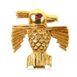 A vintage, 14 ct yellow gold, stylised, bird brooch with ruby eye