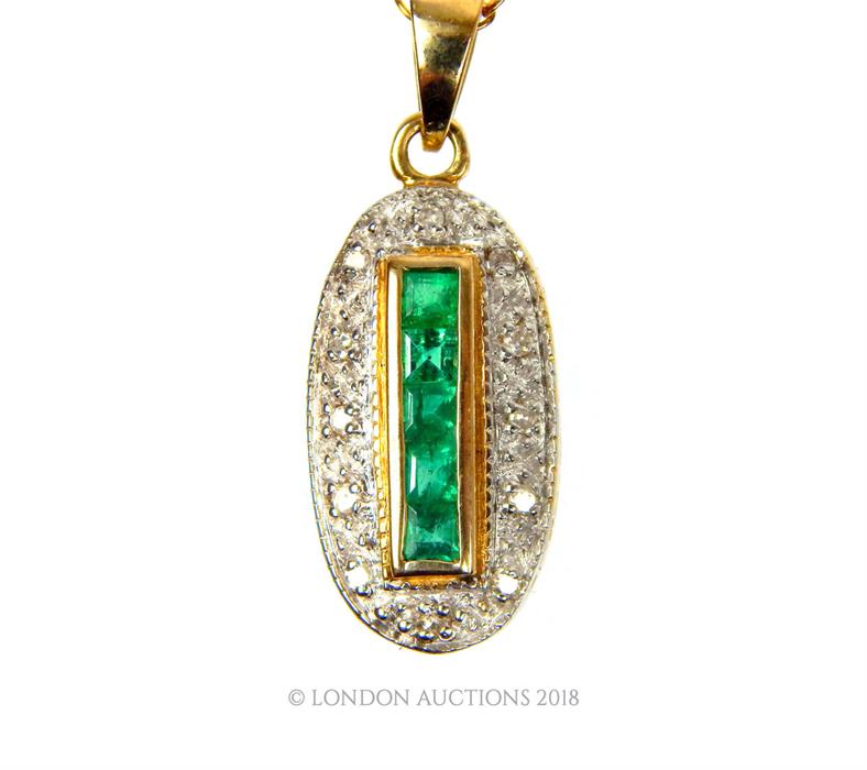 A 9 ct yellow gold, diamond and emerald pendant on a 9 ct yellow gold chain