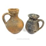 Two large, Roman, earthenware, handled jugs (1st - 3rd C AD)