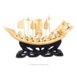 An early 20th century, Chinese, ivory, dragon-boat carving