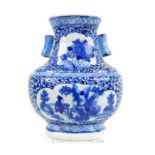 A Chinese, hand-painted, blue and white vase