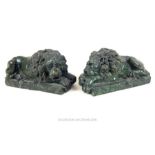 A pair of carved green marble recumbent lions after Antonio Canova