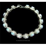 A sterling silver, white crystal and opalite, cluster bracelet