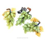Three, bunches of decorative, green jade grapes