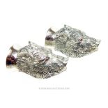 A pair of 800 silver condiment set in the form of wild boar heads