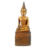A carved and giltwood seated Burmese Buddha