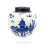 A Chinese, hand-painted, blue and white ginger jar with carved wooden cover