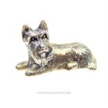 A solid, sterling silver, miniature figure of a seated terrier dog