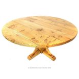 A circular honey oak table