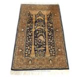 A fine, Isfahan, carpet decorated centrally with three arches and an exotic bird
