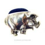 A sterling silver, miniature pig, pin cushion