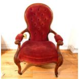 A Victorian mahogany spoon back open armchair