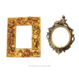 A small oval mirror and a rectangular mirror