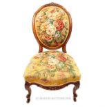 A Victorian walnut nursing chair