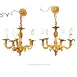 A pair of gilt metal five branch chandeliers