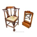 An early 20th century Georgian style mahogany child's corner chair and a hall mirror