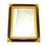 A contemporary gilt & ebonised wall mirror