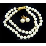 A cultured pearl necklace and stud earrings with 9 ct yellow gold fittings