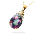 A 9 ct yellow gold mystic topaz pendant on 9 ct yellow gold chain