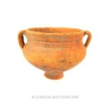 A Graeco-Roman, terracotta, twin-handled vessel (1st - 3 rd C AD)