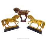 A pair of cast-iron and brass fire-ends in the shape of horses with other