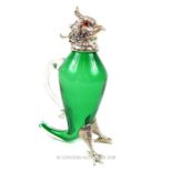 A silver plated and hand blown green glass claret jug