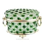 A green cut glass trinket box