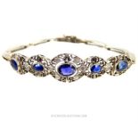 AN UNUSUAL, DIAMOND AND SAPPHIRE BRACELET.