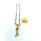 An Indian, 22 ct yellow gold beaded necklace and 22 ct ring