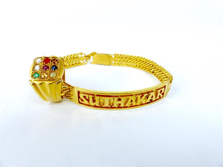 A 22 ct yellow gold bracelet and 22 ct yellow gold, gem-set ring