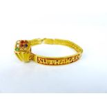 A 22 ct yellow gold bracelet and 22 ct yellow gold, gem-set ring