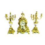 A Rococo style gilt metal and porcelain clock garniture