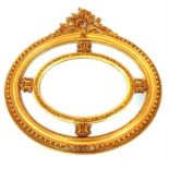 A giltwood oval wall mirror