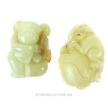A Chinese jade carving of monkey and a carving of a boy