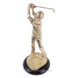 A silvered figure of a golfer