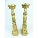 A Pair of Carved Giltwood Pricket Table Candlesticks.