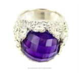 A substantial, sterling silver and faceted amethyst ring