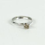 An 18 ct white gold, champagne coloured diamond, solitaire ring