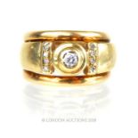A 9 ct yellow gold, chunky, brilliant cut diamond ring